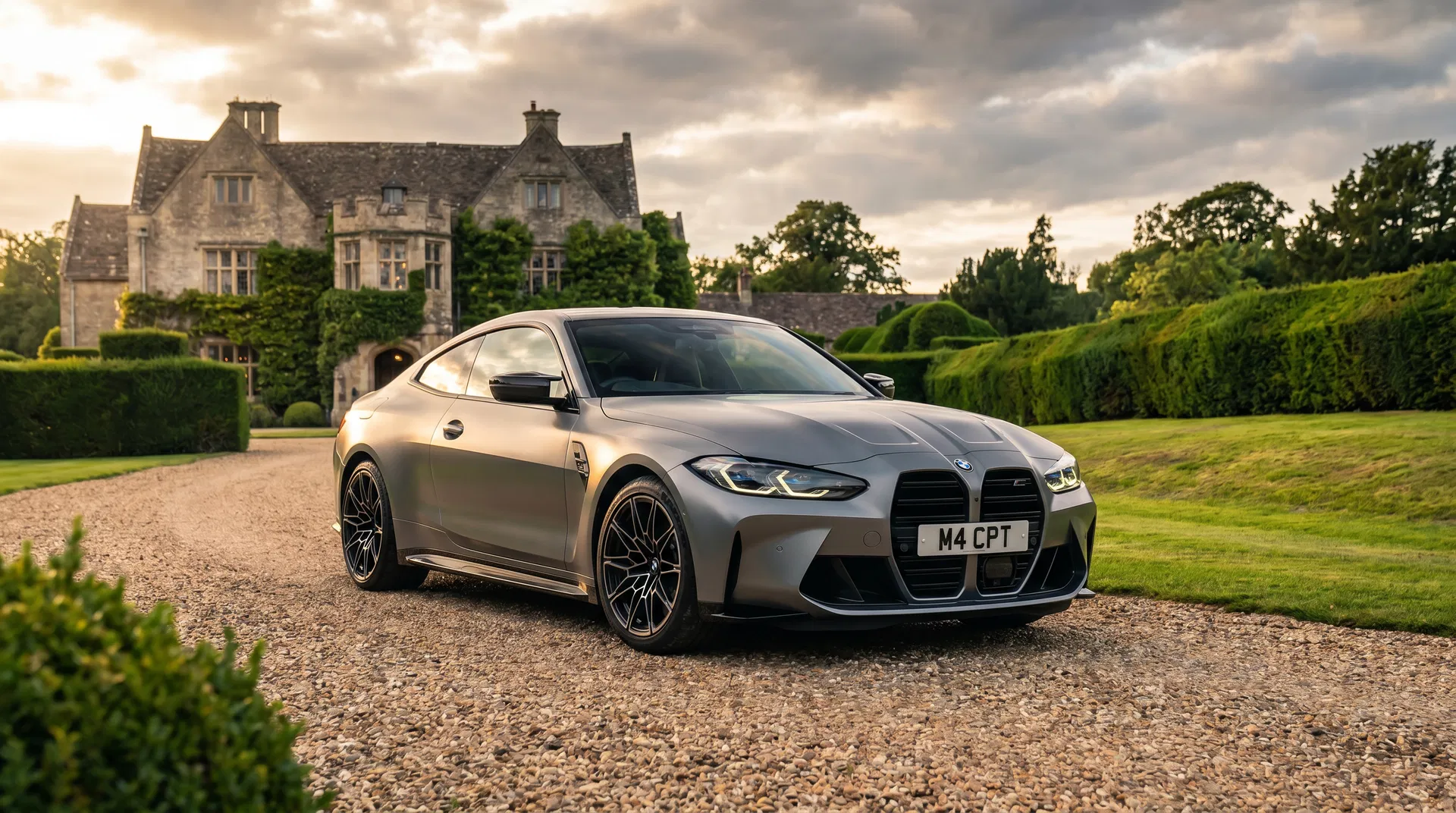 Modern BMW M4 Competition on a country estate driveway