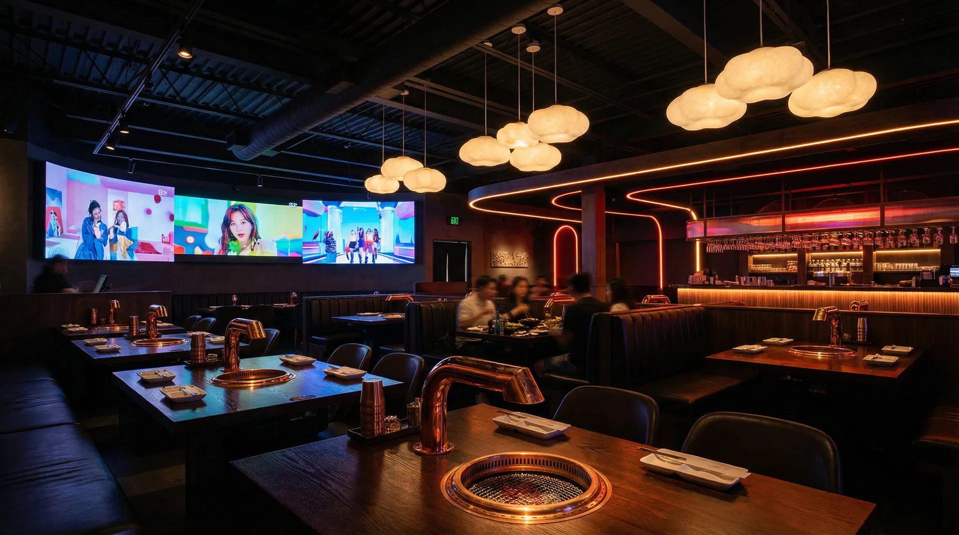 Restaurant interior with K-pop screens and cloud lamps