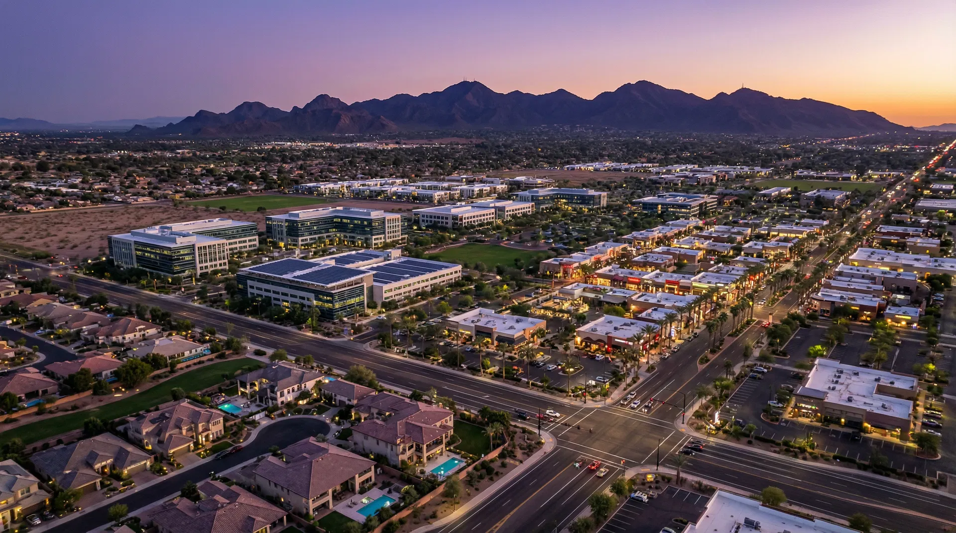 Chandler Arizona tech hub at twilight with San Tan Mountains