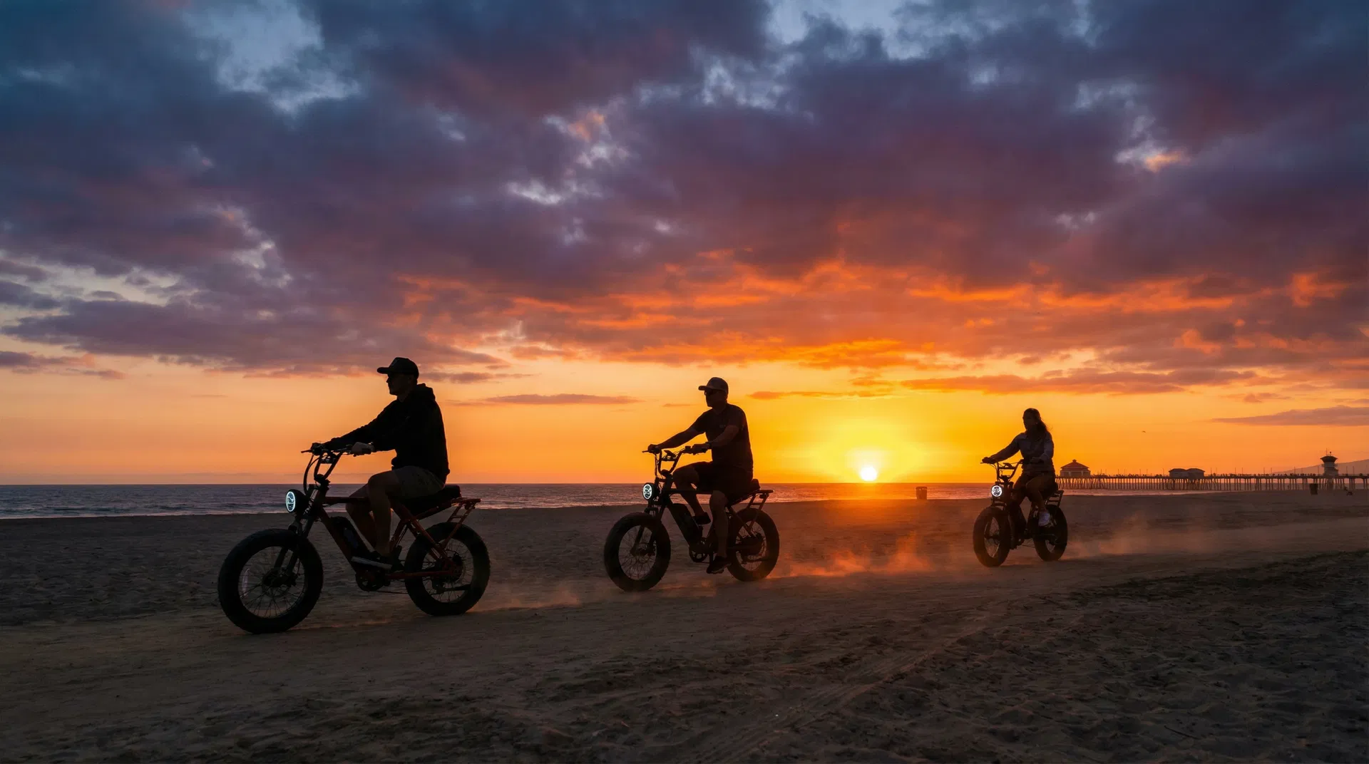 Group riding e-bikes at sunset on Huntington Beach