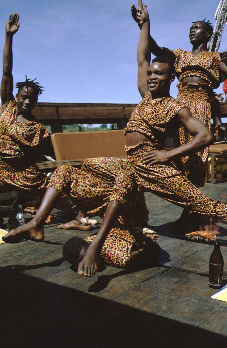 African Dancers in Leopard Print Costumes on a Stage