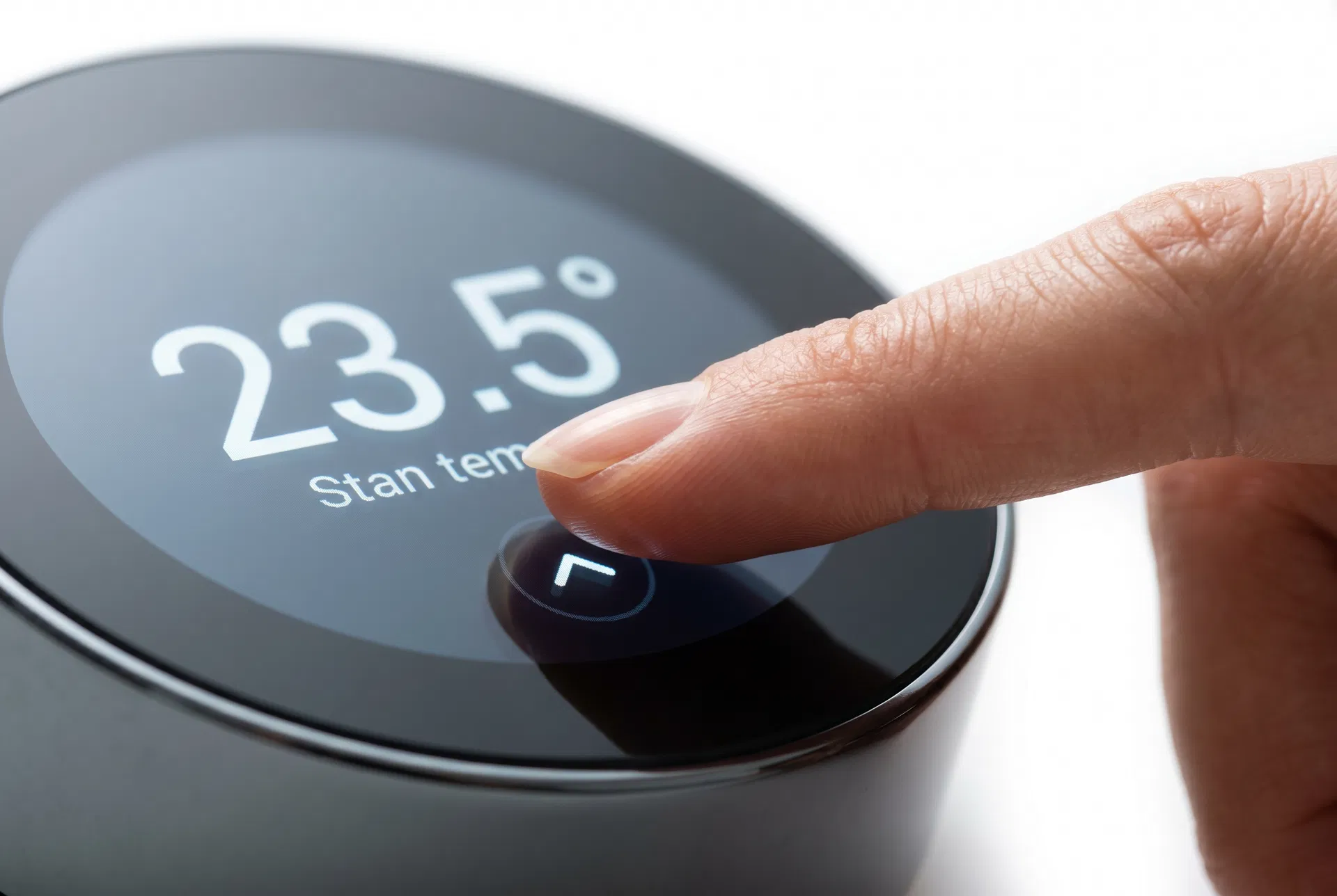 Finger touching ETER thermostat screen