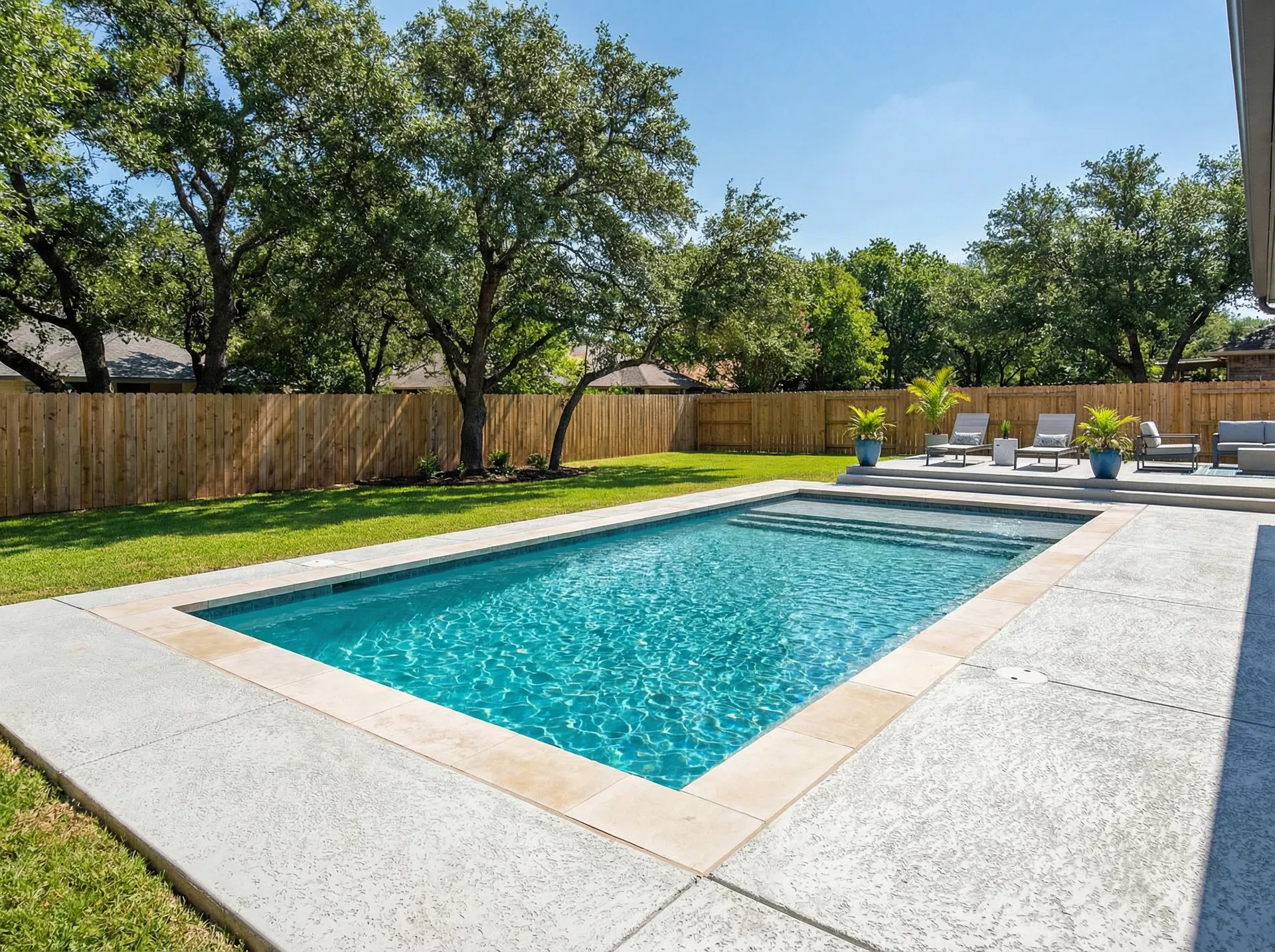 Completed pool renovation with new deck and vinyl liner