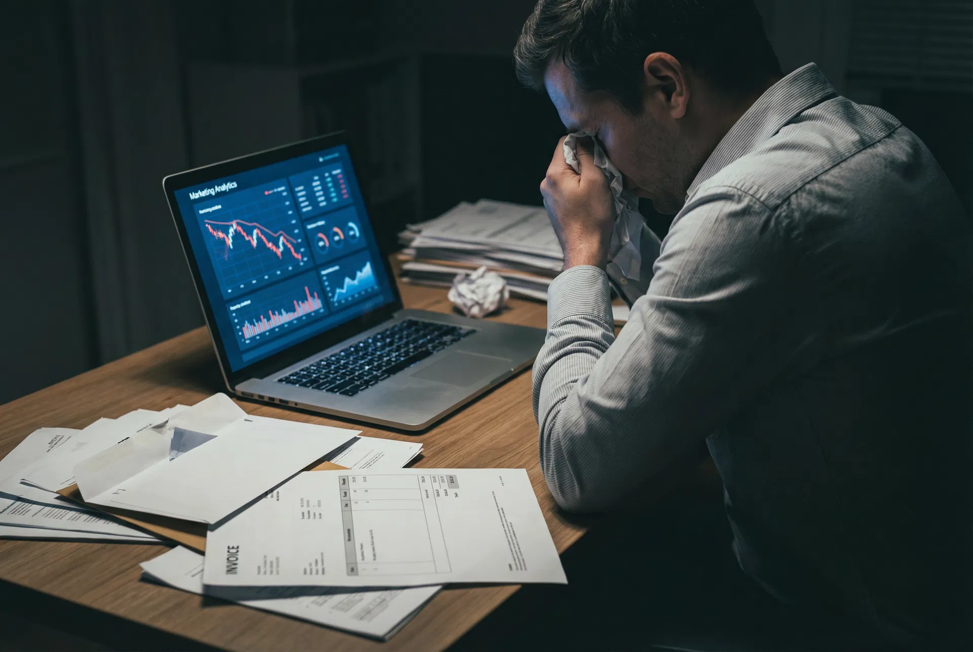 Frustrated contractor reviewing marketing reports