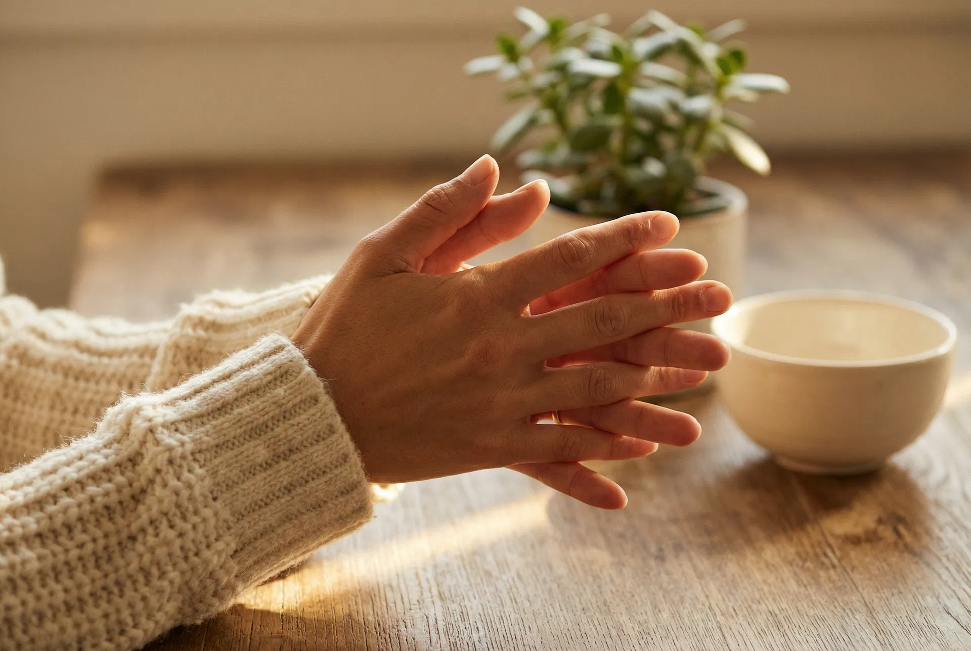 Hands stretching comfortably in warm morning light