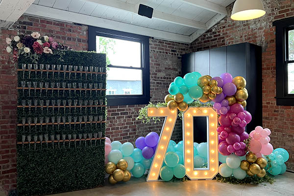 70th Birthday Party - Champagne Wall and Balloon Decor