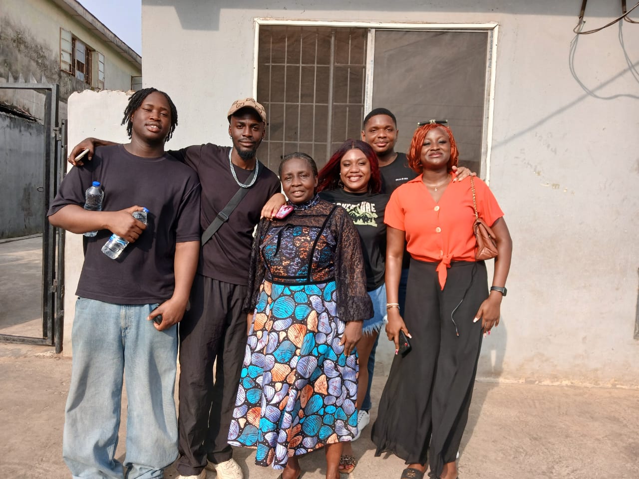 University student volunteers with street children during community visit on 28 December