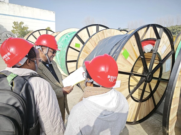 Team inspecting cable drums before shipment