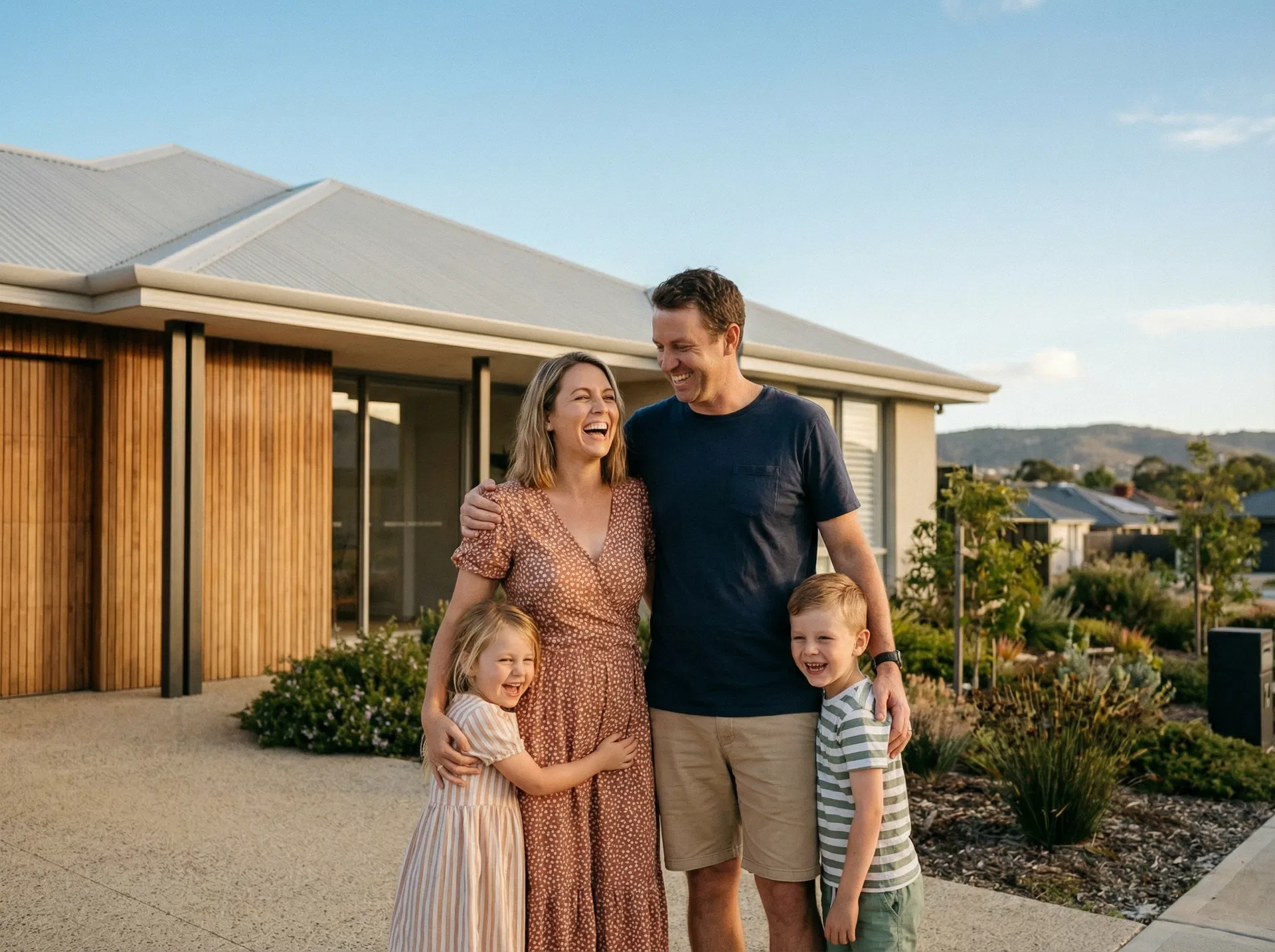 Happy Perth family in front of their new home
