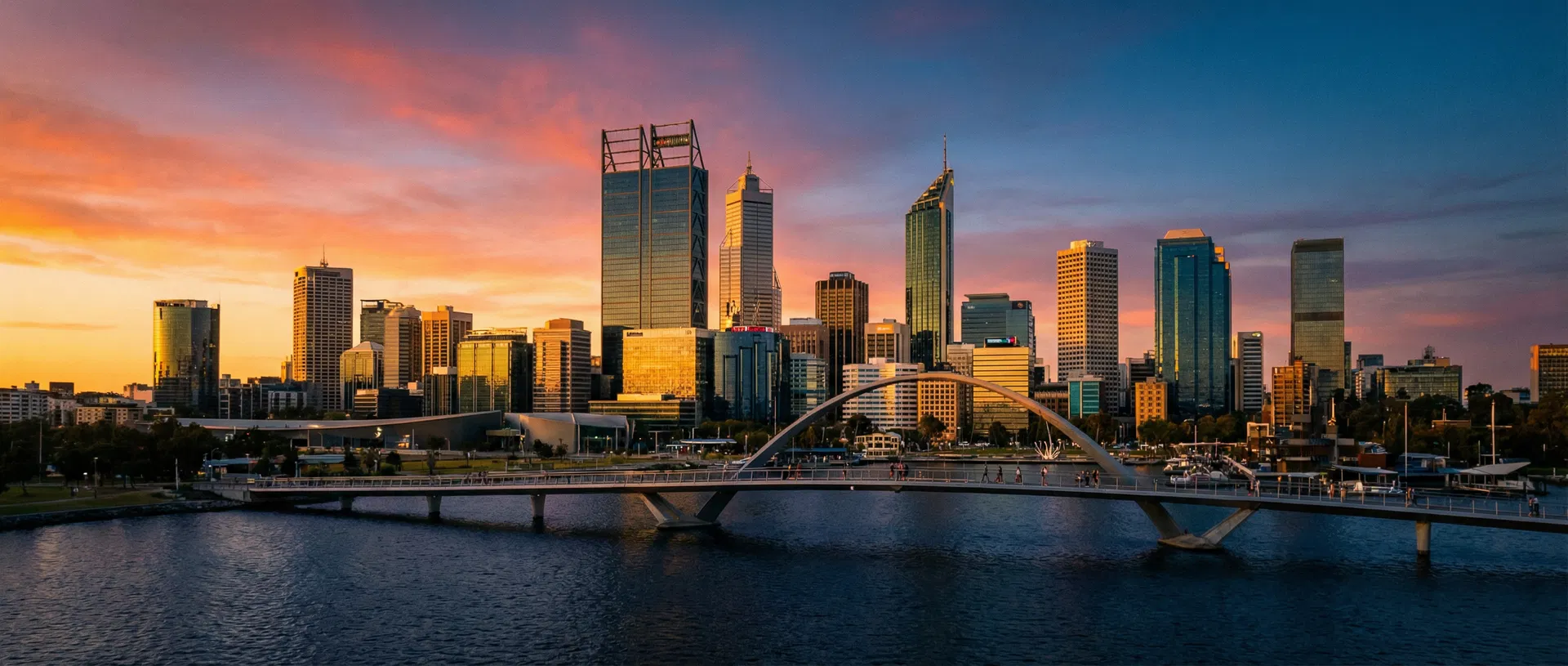 Perth skyline at sunset across the Swan River