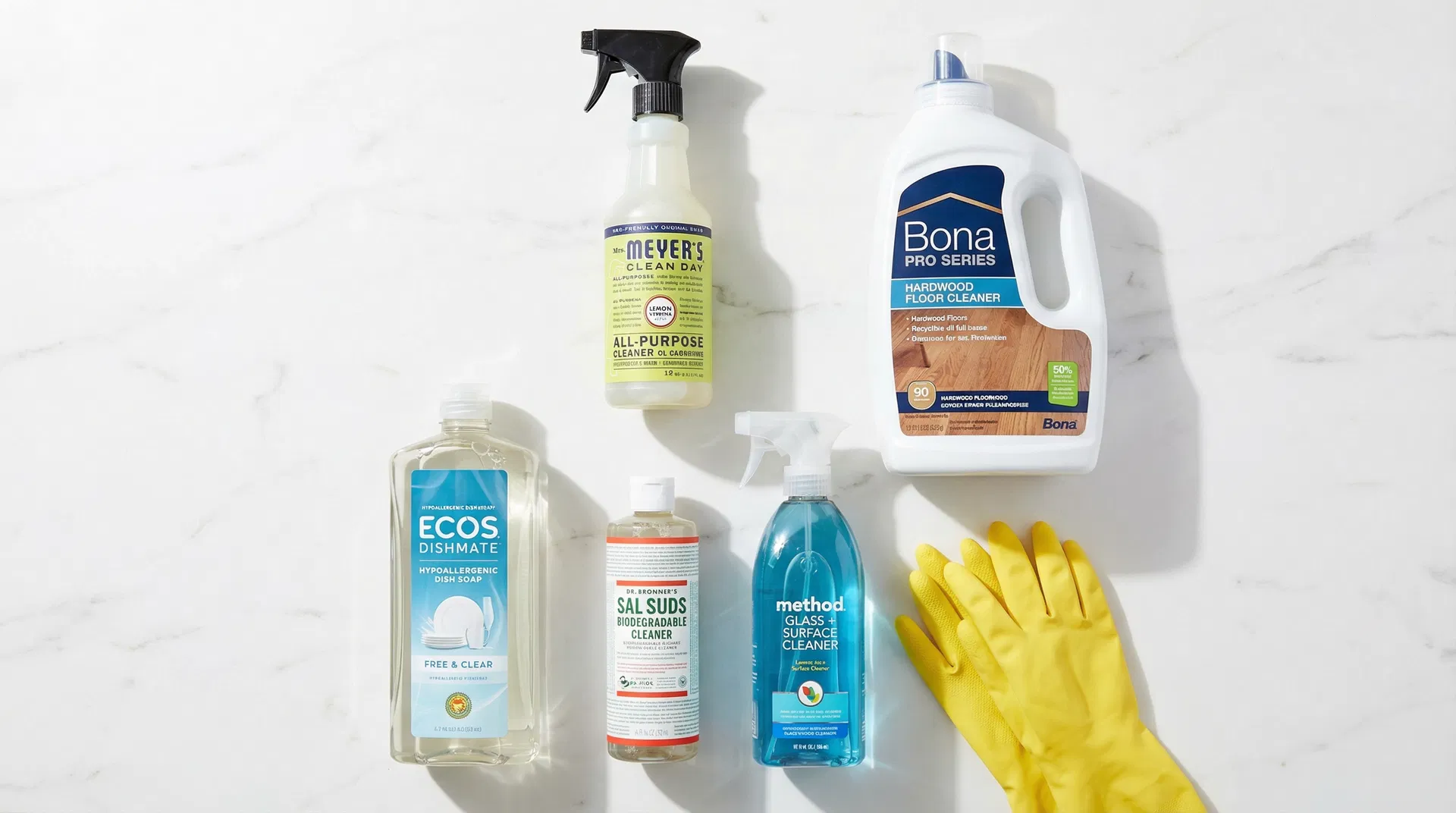 Mixing a DIY all-purpose cleaner with vinegar, castile soap, and essential oils in a San Francisco kitchen