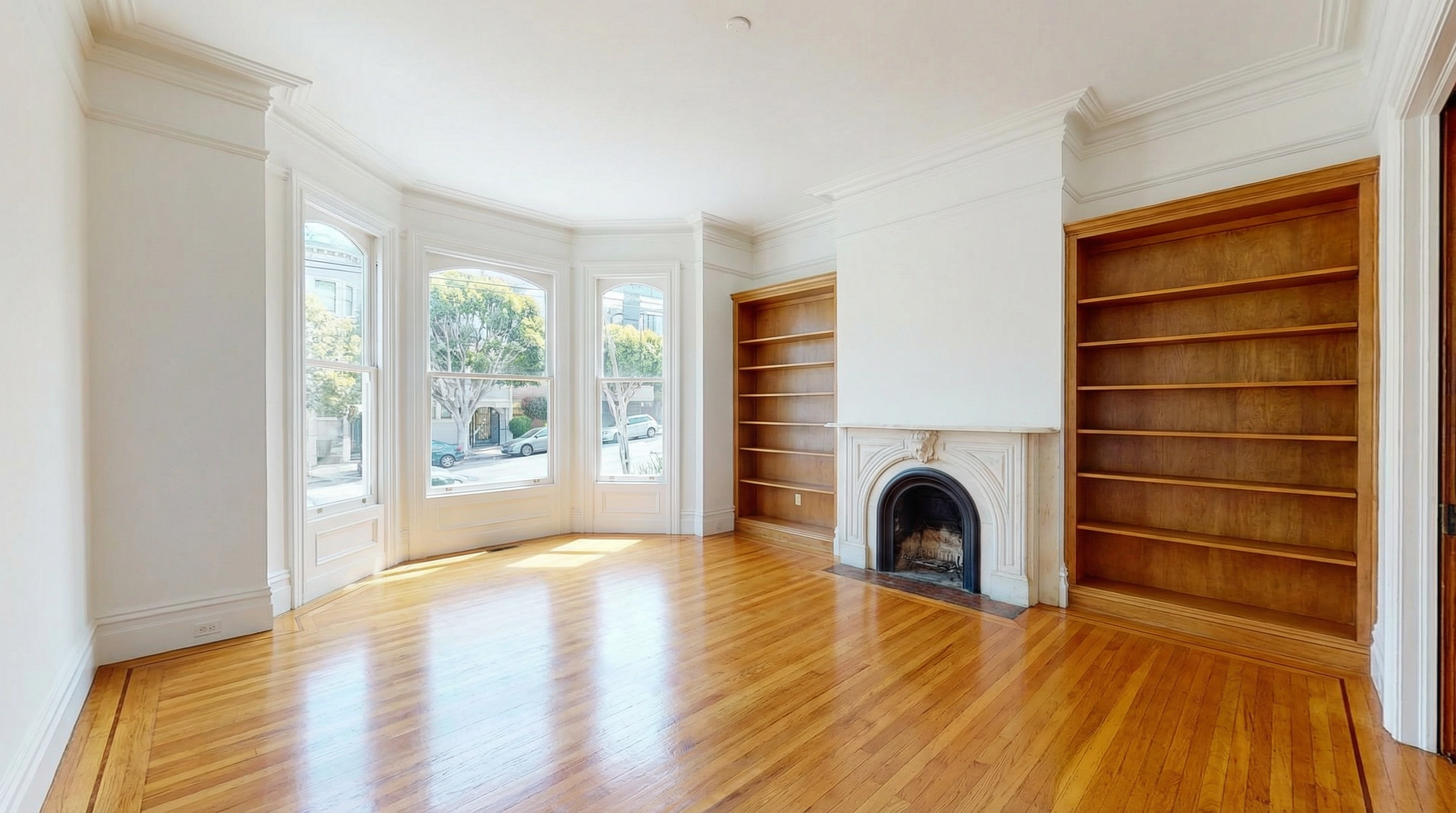 Spotlessly clean empty San Francisco Victorian apartment ready for move-out inspection — gleaming hardwood floors, bay windows