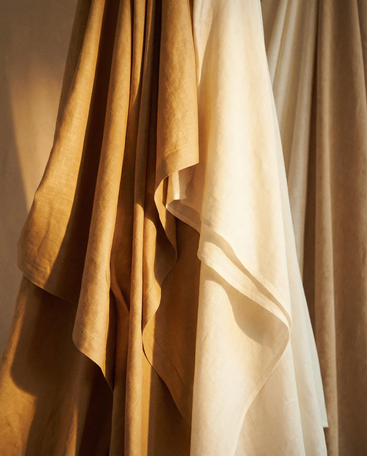 Draped fabric in burnished gold and ivory tones