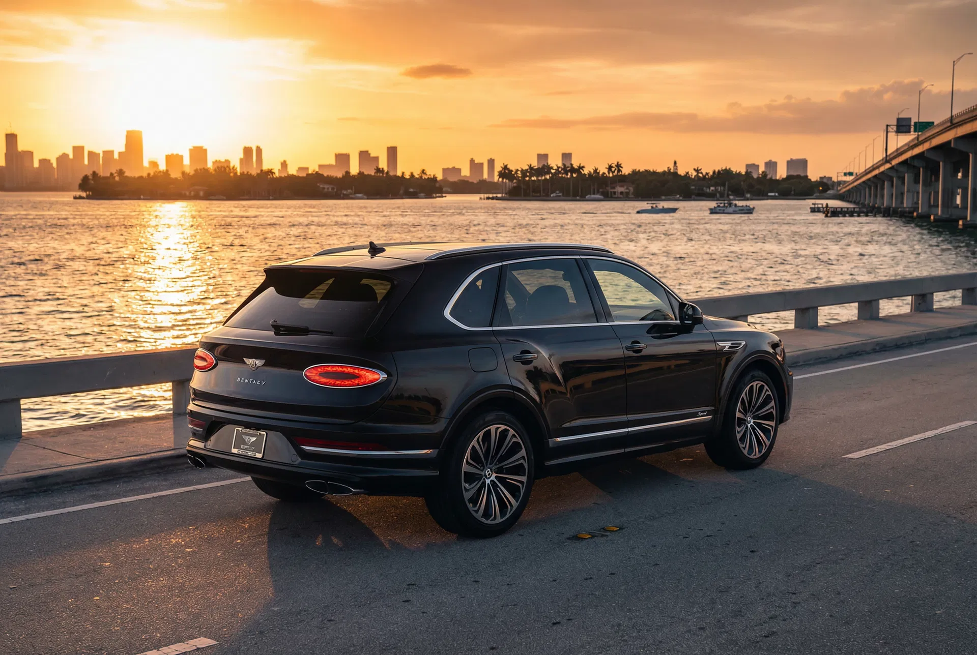 2025 Bentley Bentayga Speed lease Miami — Venetian Causeway sunset over Biscayne Bay