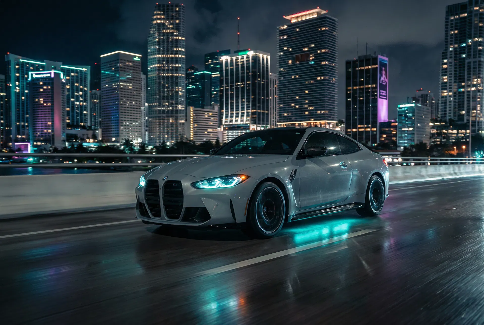 2025 BMW M4 Competition lease Miami — MacArthur Causeway night shot with downtown skyline