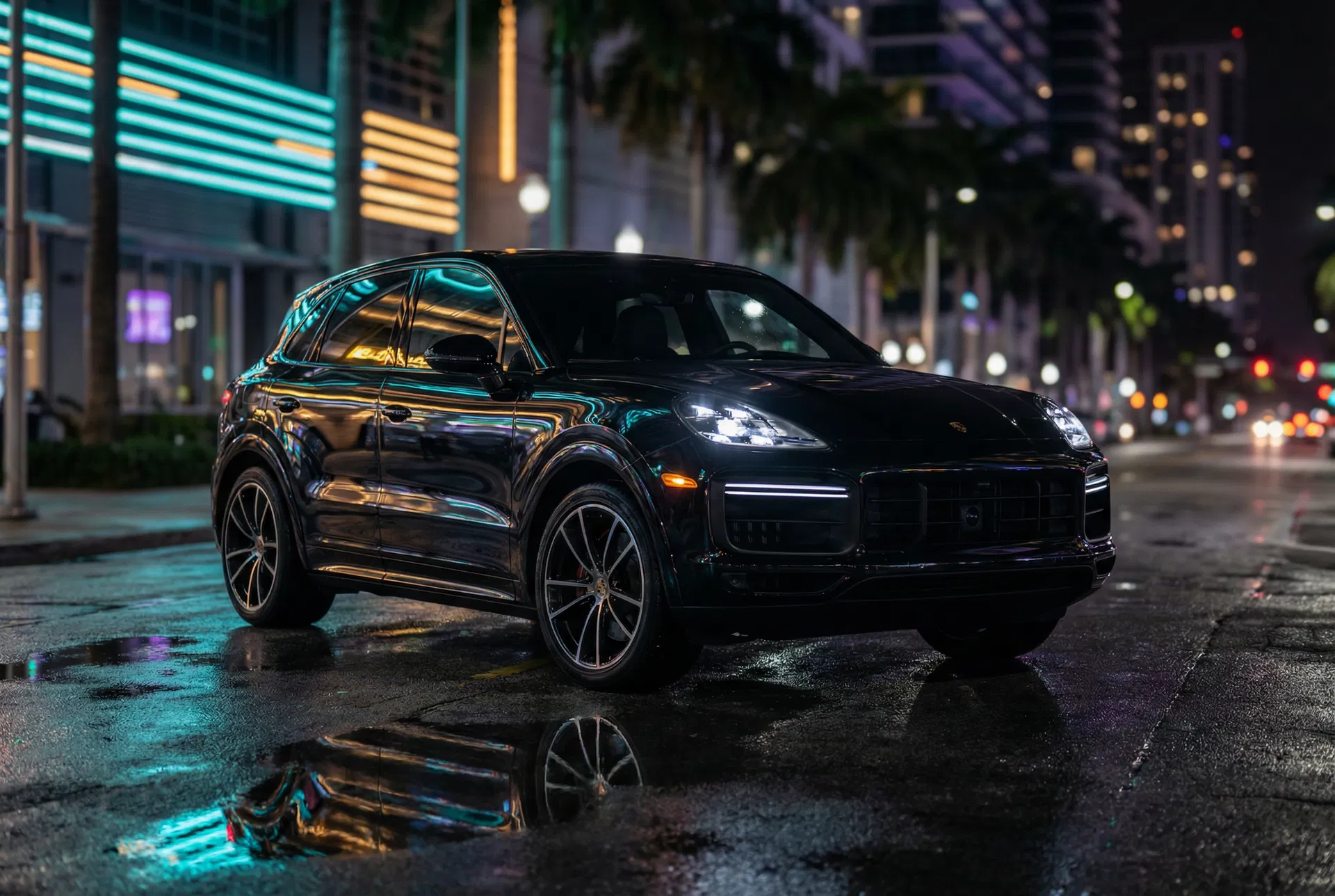 2025 Porsche Cayenne GTS lease Miami — cinematic night shot on wet Brickell street
