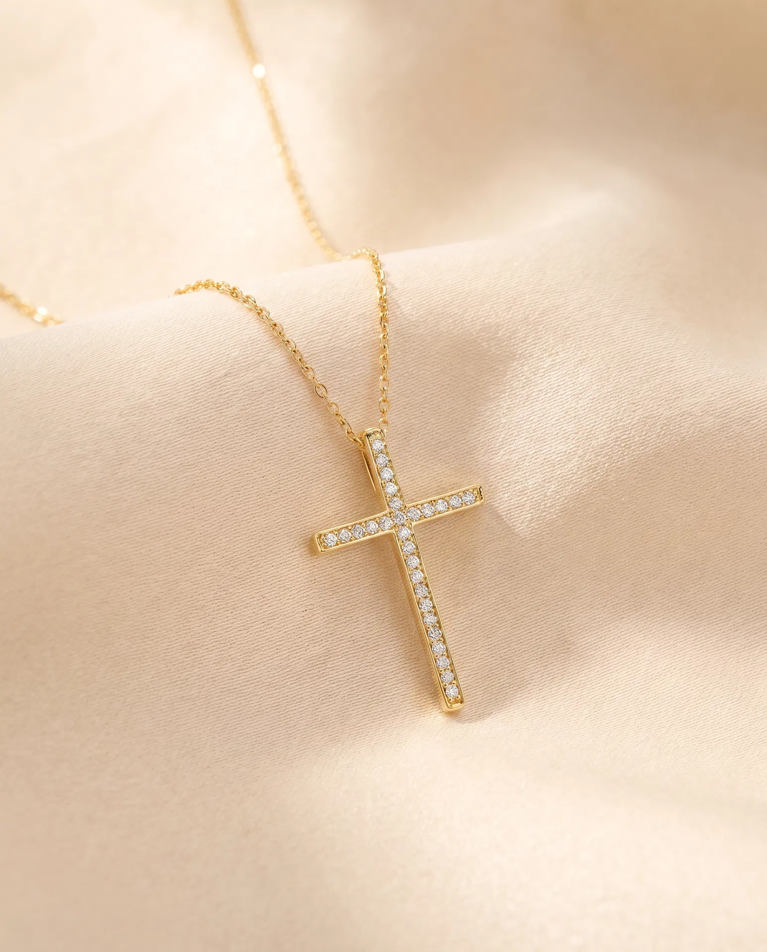 Gold cross necklace with diamond accents