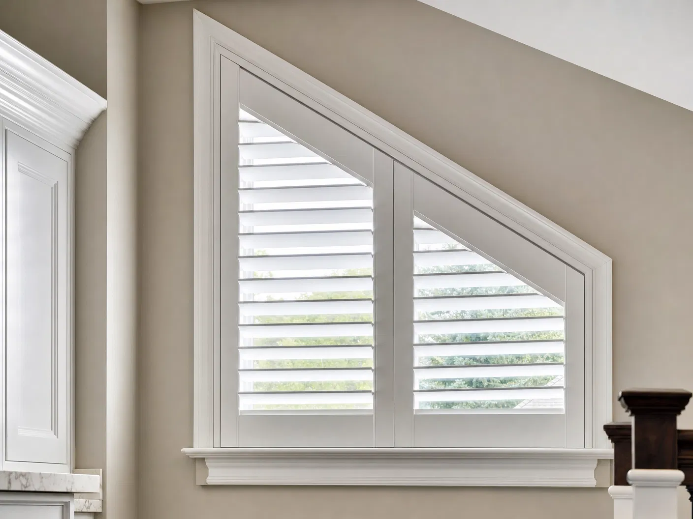 Slant-top window fitted with custom white plantation shutters