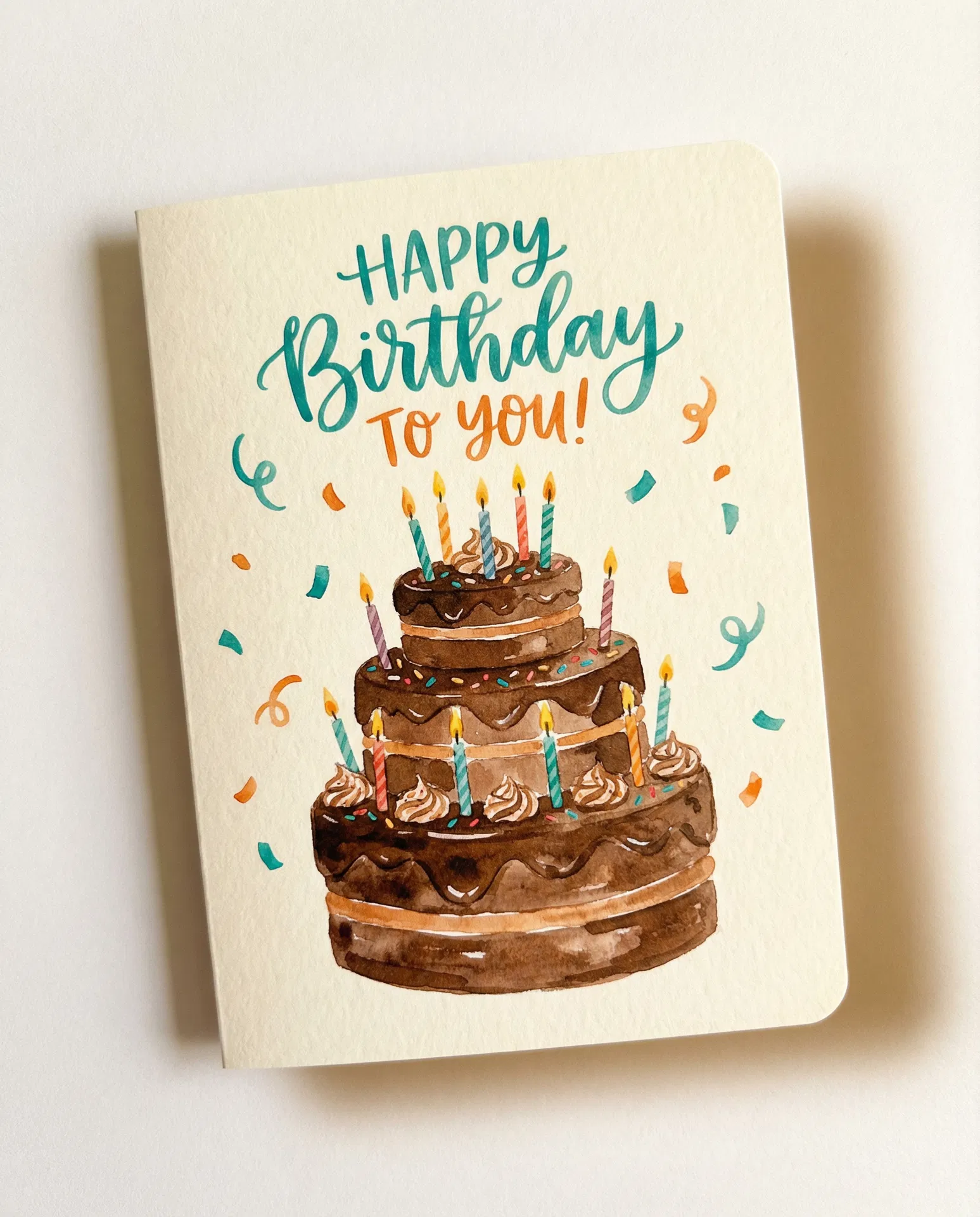 AI-generated birthday card with chocolate cake and confetti