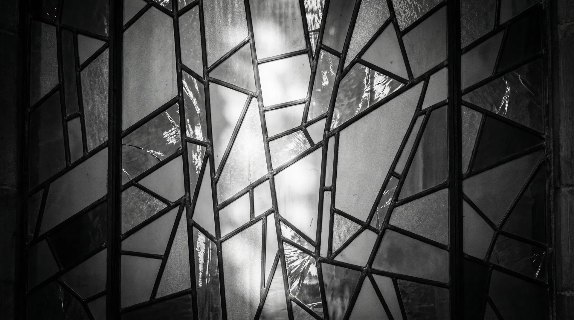 Abstract stained glass mosaic in black and white, representing the eclectic, multifaceted approach of Eclectic Counseling