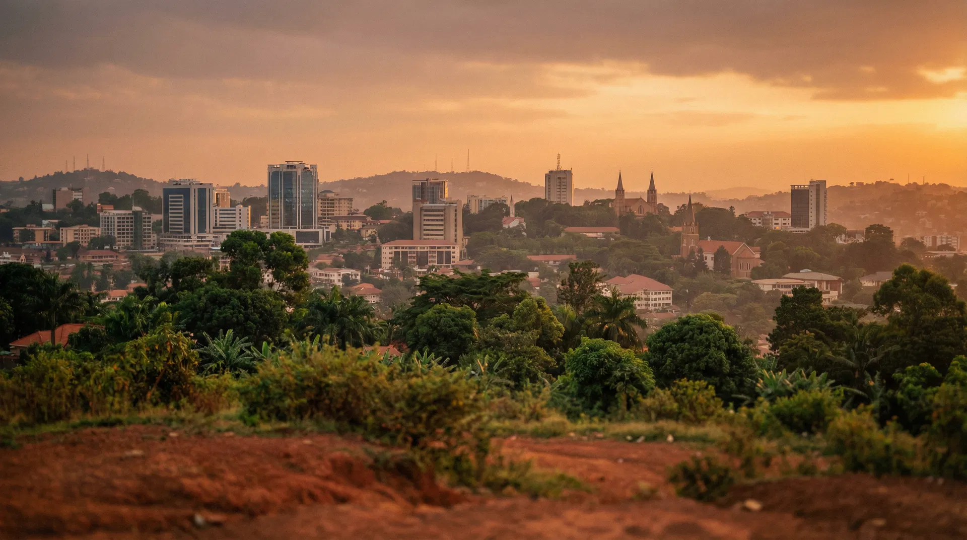 Kampala skyline at golden hour — the hills, greenery, and modern buildings of Uganda's capital