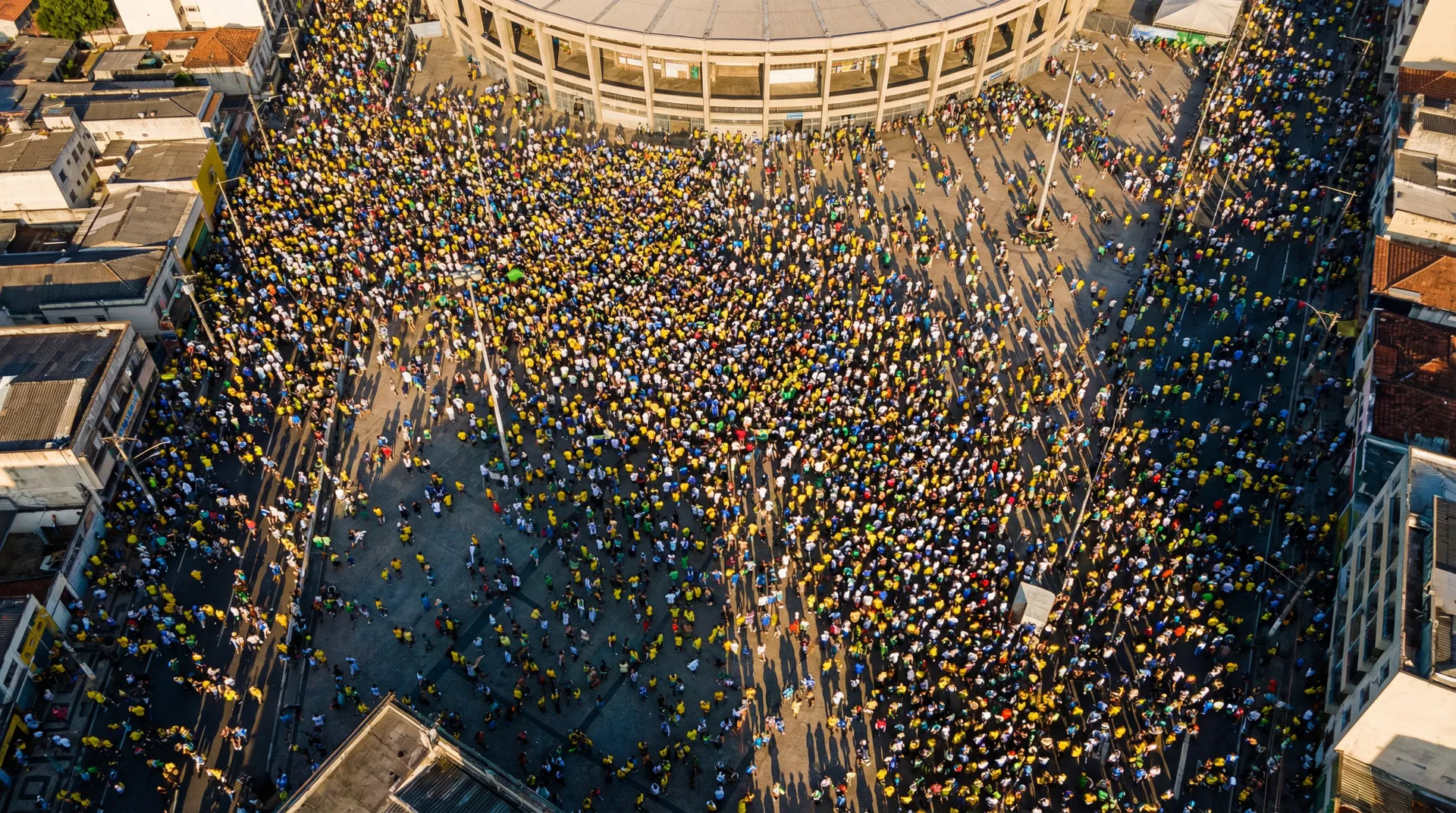 Aerial view of massive crowd near stadium