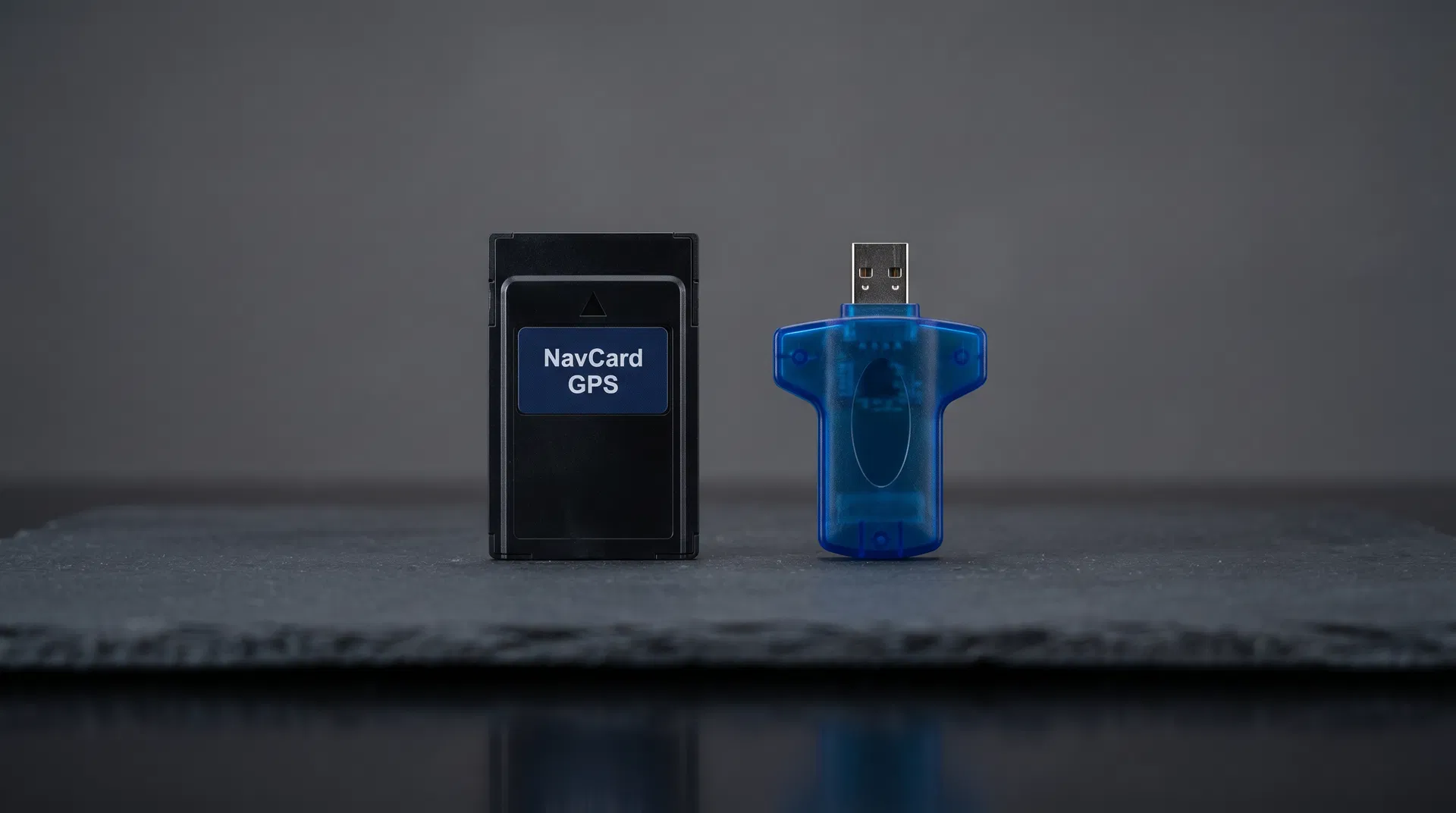 NavCard GPS data card and USB programmer on dark slate