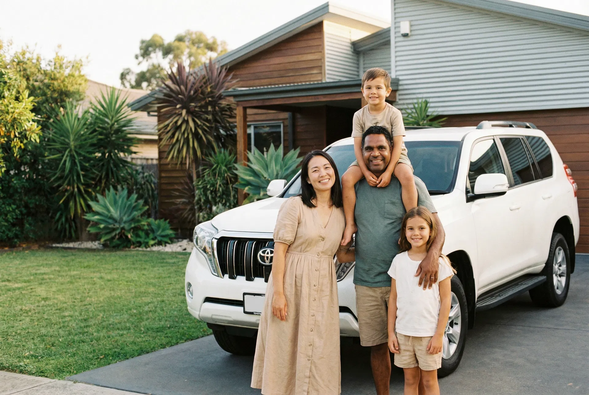 Happy Australian family with their new car
