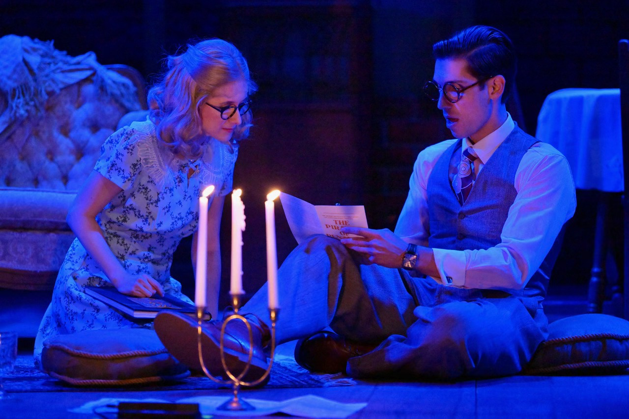 The Glass Menagerie - Scenic design by Brandon PT Davis. Evocative set with fragmented walls, soft, dreamlike lighting, and sparse furniture, conveying a poignant memory.