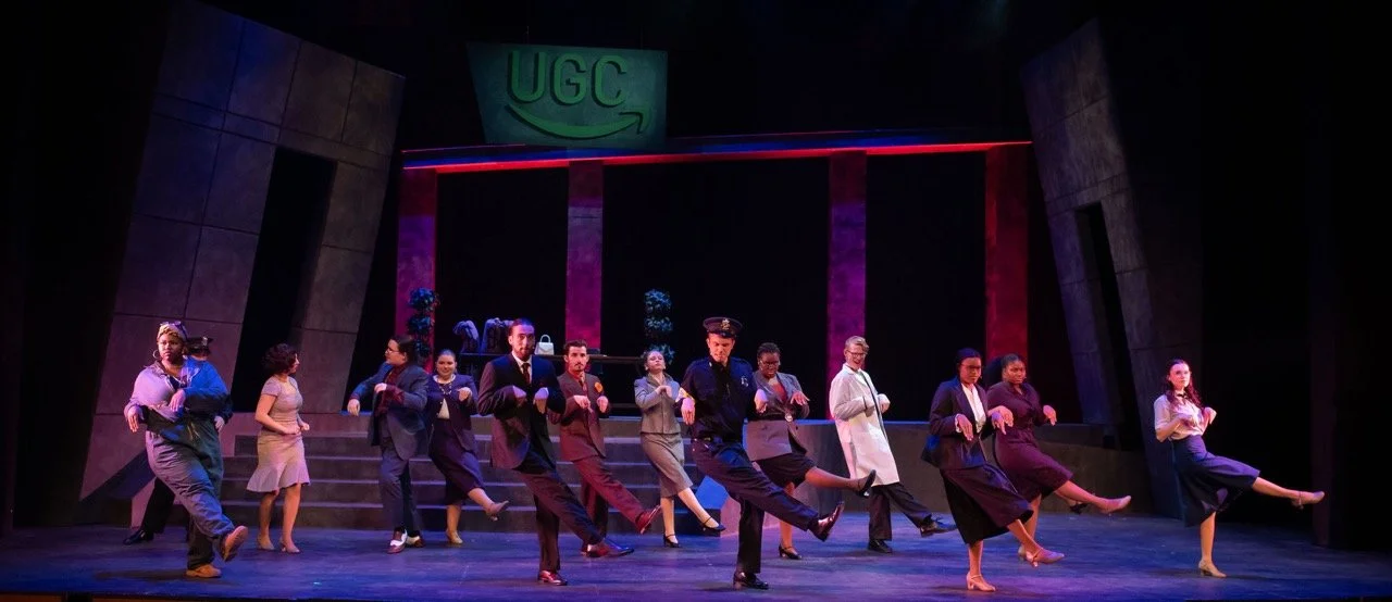 Urinetown - Scenic design by Brandon PT Davis. Gritty, industrial set with stark lighting and distressed textures, conveying a dystopian society grappling with resource scarcity.