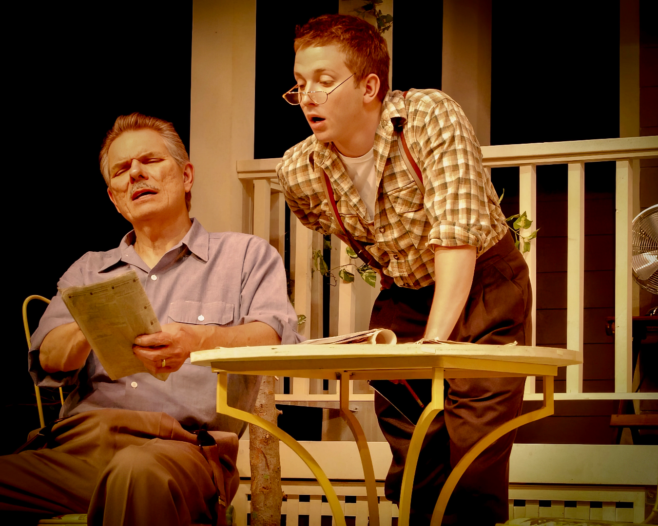 A Christmas Carol - Scenic design by Brandon PT Davis. Victorian London streetscape with cobblestones, gas lamps, and snow-dusted rooftops, evoking Dickensian charm.