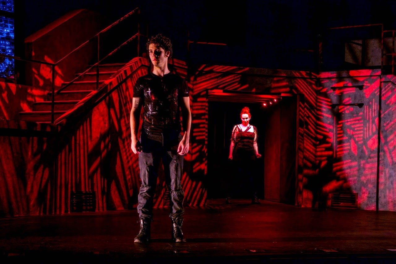 American Idiot - Scenic design by Brandon PT Davis. Dynamic stage with industrial elements and bold lighting, reflecting the punk rock energy of the musical.
