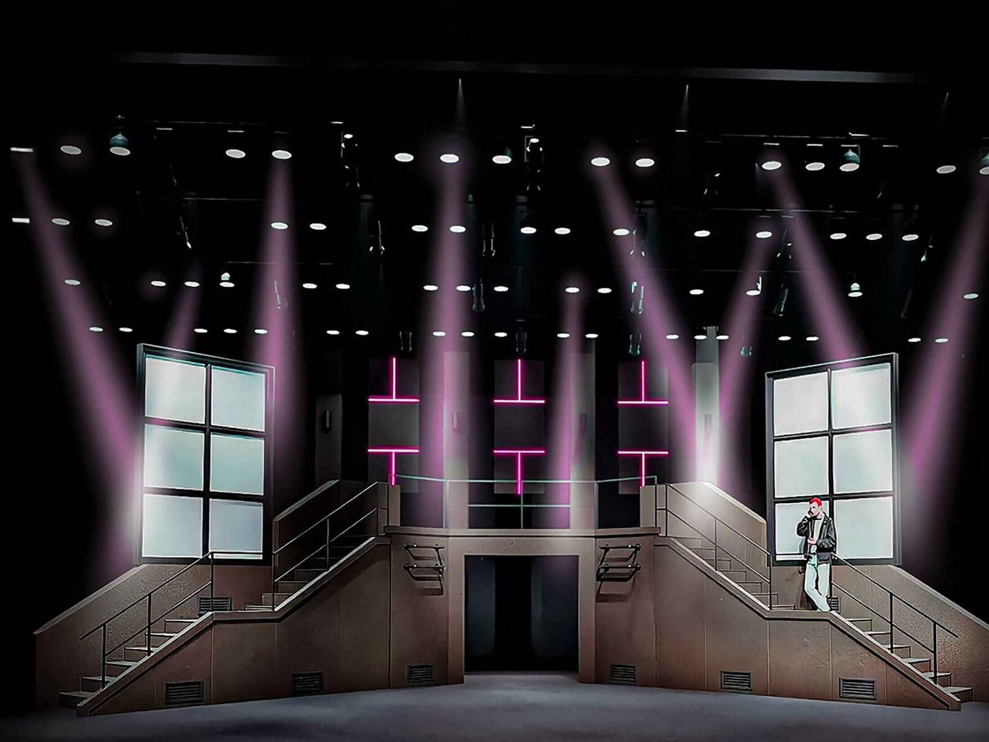 American Idiot - Scenic design by Brandon PT Davis. Gritty urban backdrop, dynamic lighting, and multi-level platforms capture punk rock energy.