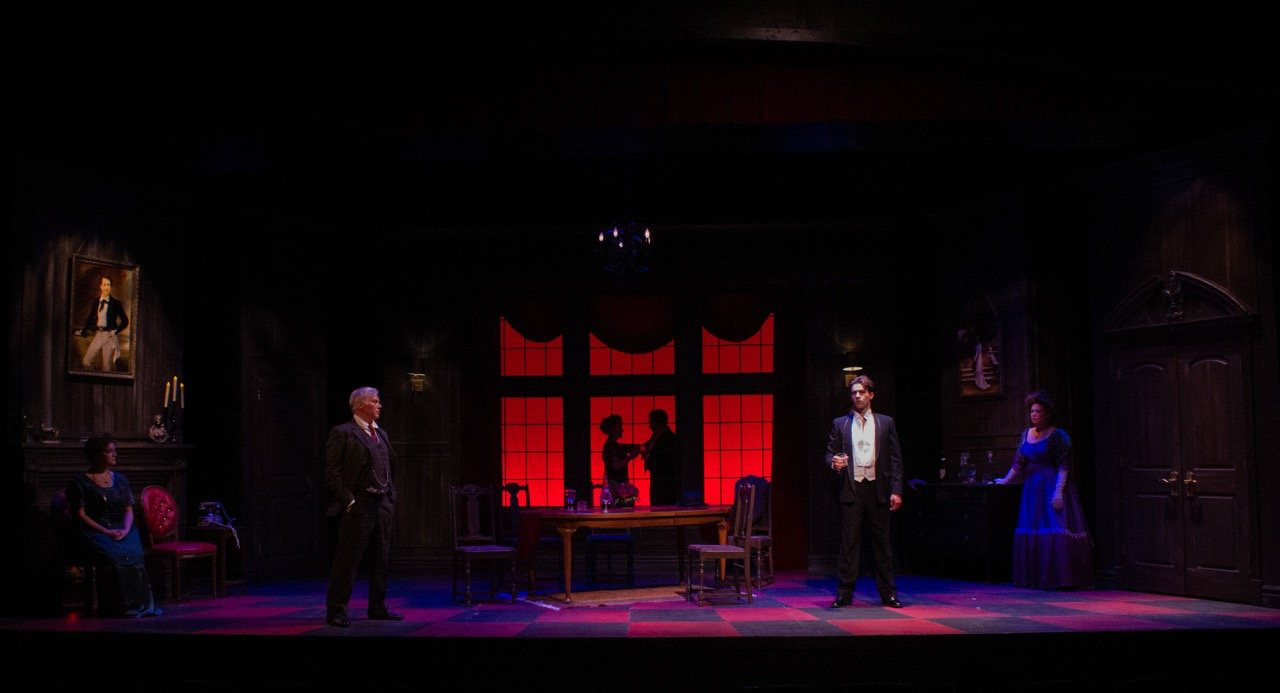 An Inspector Calls - Scenic design by Brandon PT Davis. Edwardian dining room, oppressive atmosphere, dark wood, and dim lighting, reflecting the family's secrets and societal pressures.