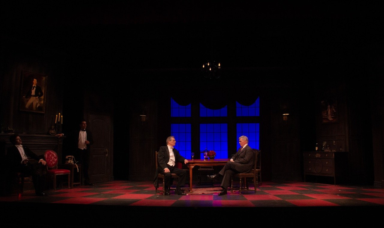 An Inspector Calls - Scenic design by Brandon PT Davis. A formal Edwardian dining room, dimly lit, with a heavy, dark atmosphere, reflecting the play's social commentary.