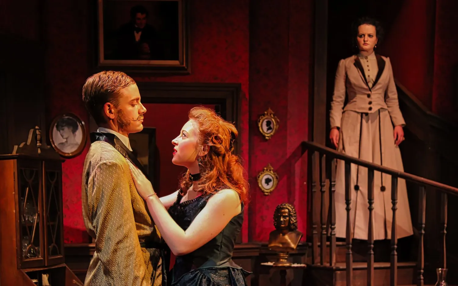 Angel Street - Scenic design by Brandon PT Davis. A dimly lit Victorian interior with heavy drapes and ornate furniture, creating a foreboding gaslight atmosphere.