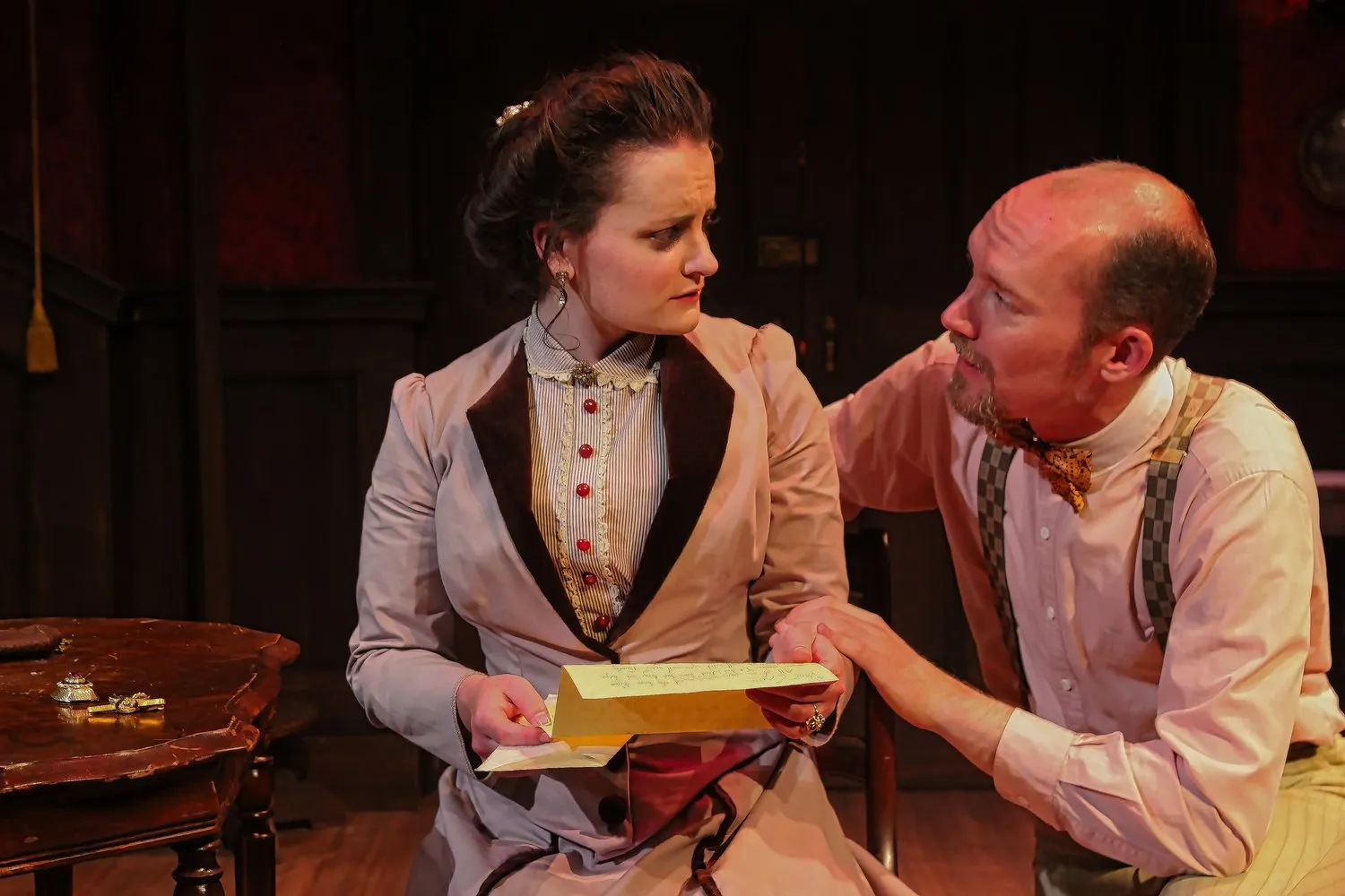 Angel Street - Scenic design by Brandon PT Davis. A dimly lit Victorian parlor with heavy drapes and antique furniture, evoking a suspenseful atmosphere.