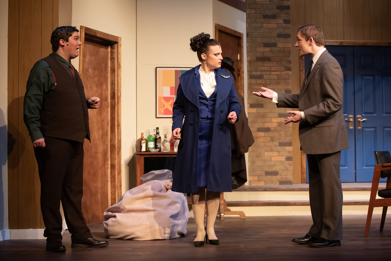 Boeing, Boeing - Scenic design by Brandon PT Davis. A vibrant, mid-century modern apartment set with multiple doors, suggesting a fast-paced comedic farce.