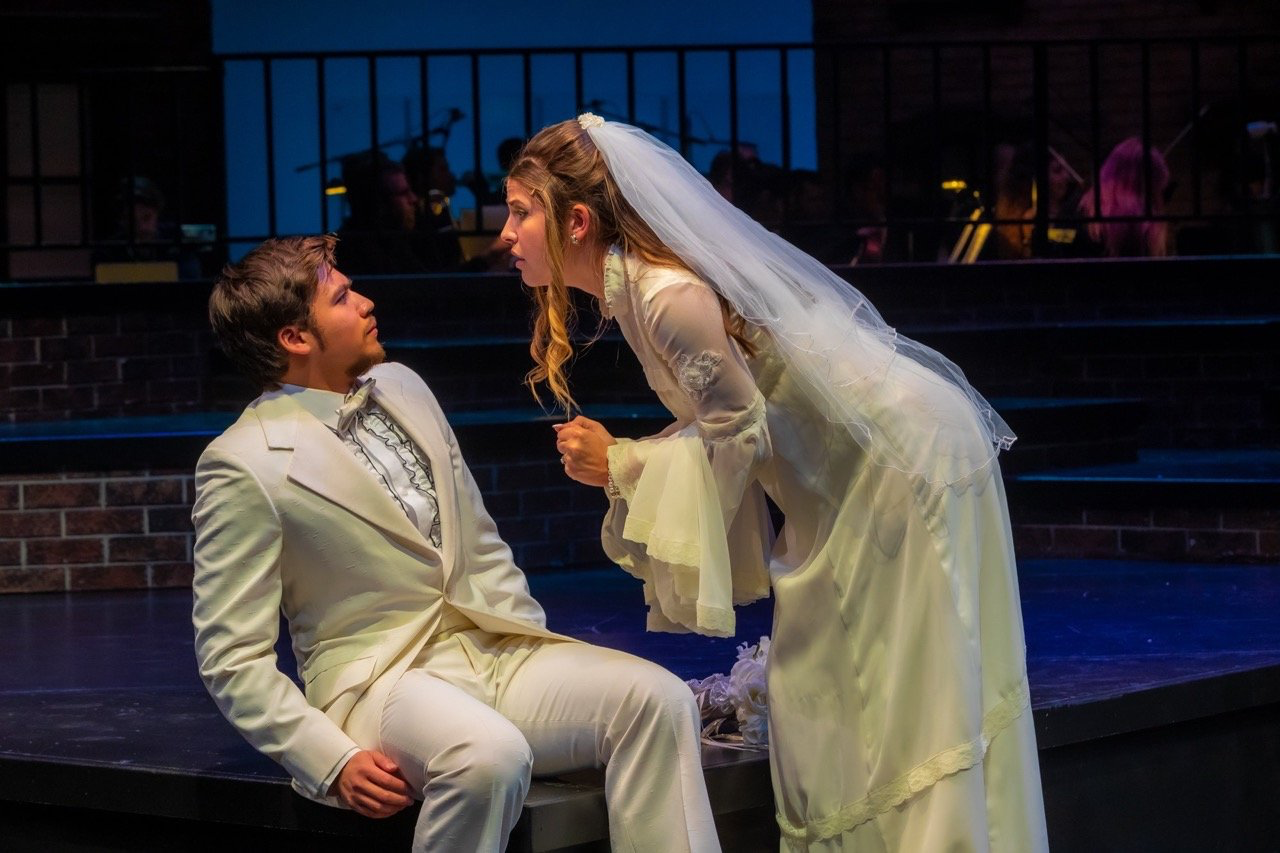 Company - Scenic design by Brandon PT Davis. Modern urban set, multi-level platforms, and dynamic lighting evoke New York City's vibrant energy and complex relationships.