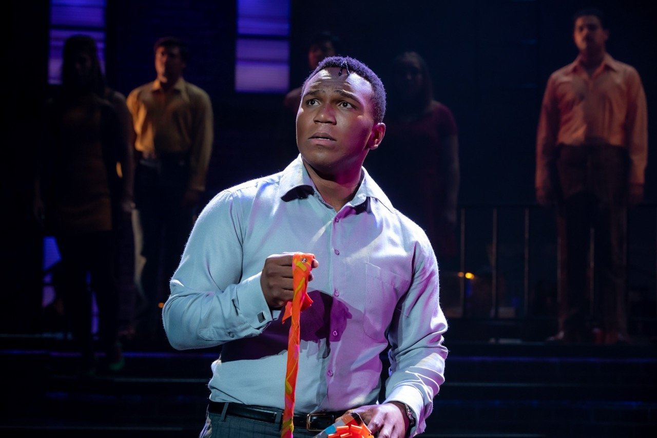 Company - Scenic design by Brandon PT Davis. Modern New York City apartment set, sleek lines, urban atmosphere capturing the complexities of relationships.