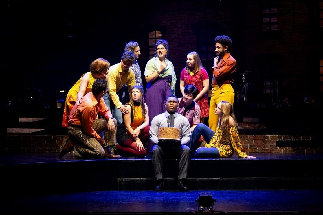 Company - Scenic design by Brandon PT Davis. Modern New York City apartment setting, dynamic multi-level platforms, cool lighting, and urban atmosphere.