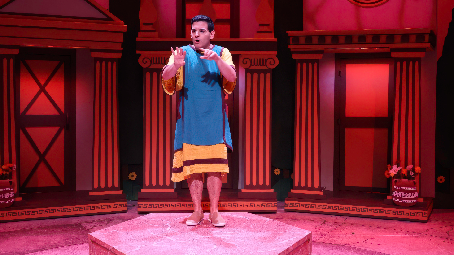 1776 - Scenic design by Brandon PT Davis. Colonial Assembly Room with period furnishings, warm wood tones, and dramatic lighting evoking Revolutionary America.