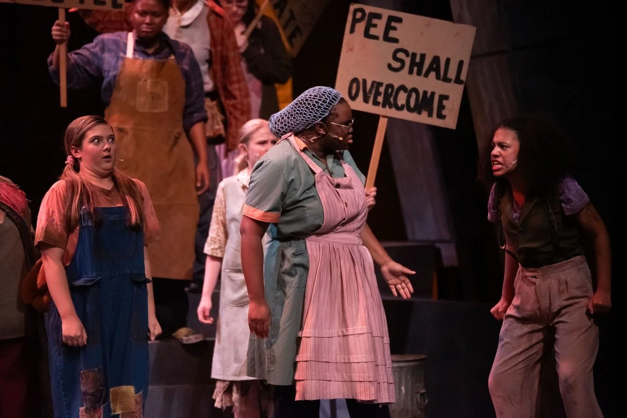 Urinetown - Scenic design by Brandon PT Davis. Dystopian urban landscape with stark, industrial elements and a sense of desperation.