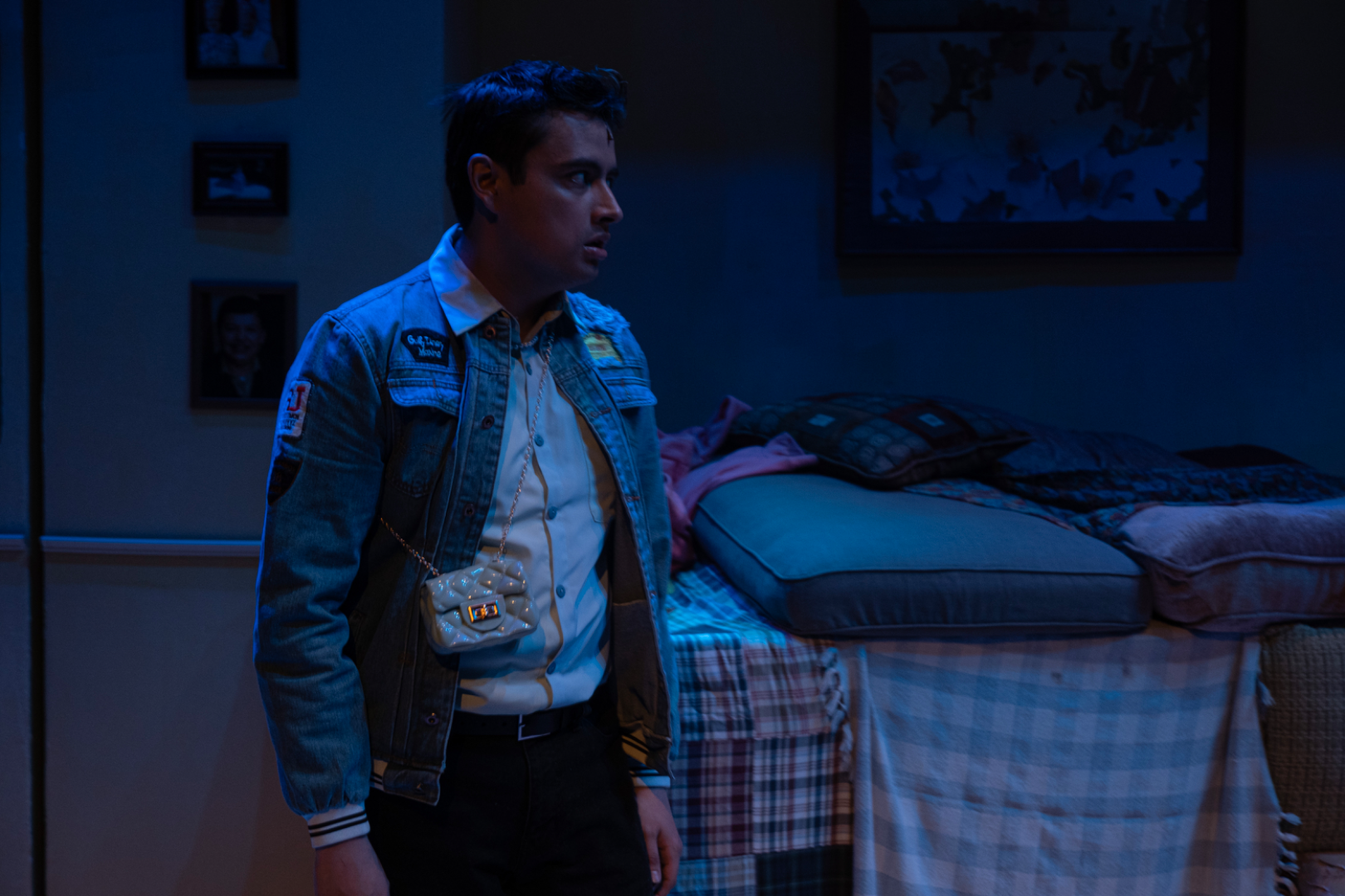 ¡LOTERIA: GAME ON! - Scenic design by Brandon PT Davis. A vibrant, game-themed suburban basement living room set.