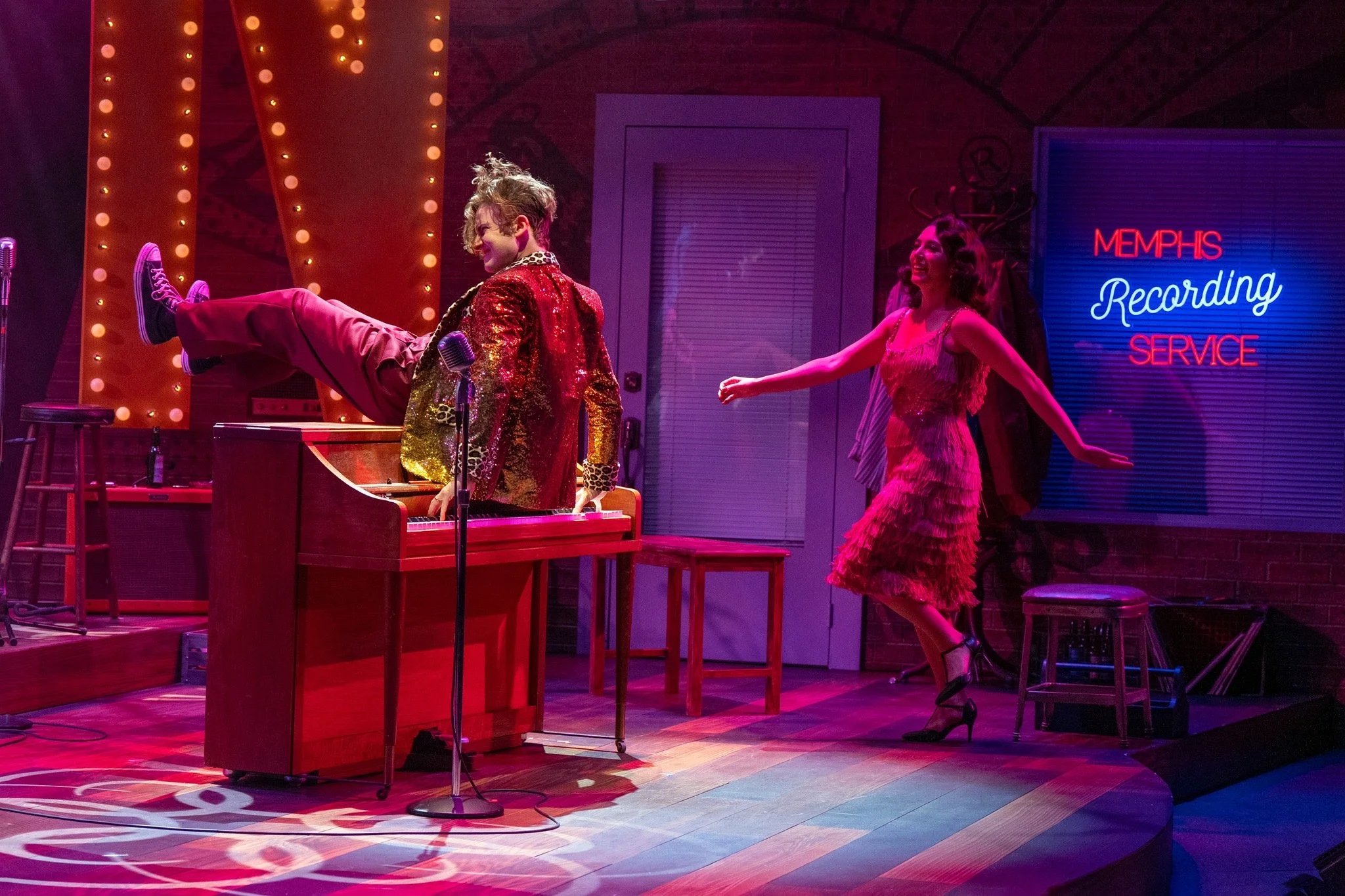 Million Dollar Quartet - Scenic design by Brandon PT Davis. A 1950s recording studio with vintage microphones, instruments, and warm stage lighting, evoking a rock and roll atmosphere.