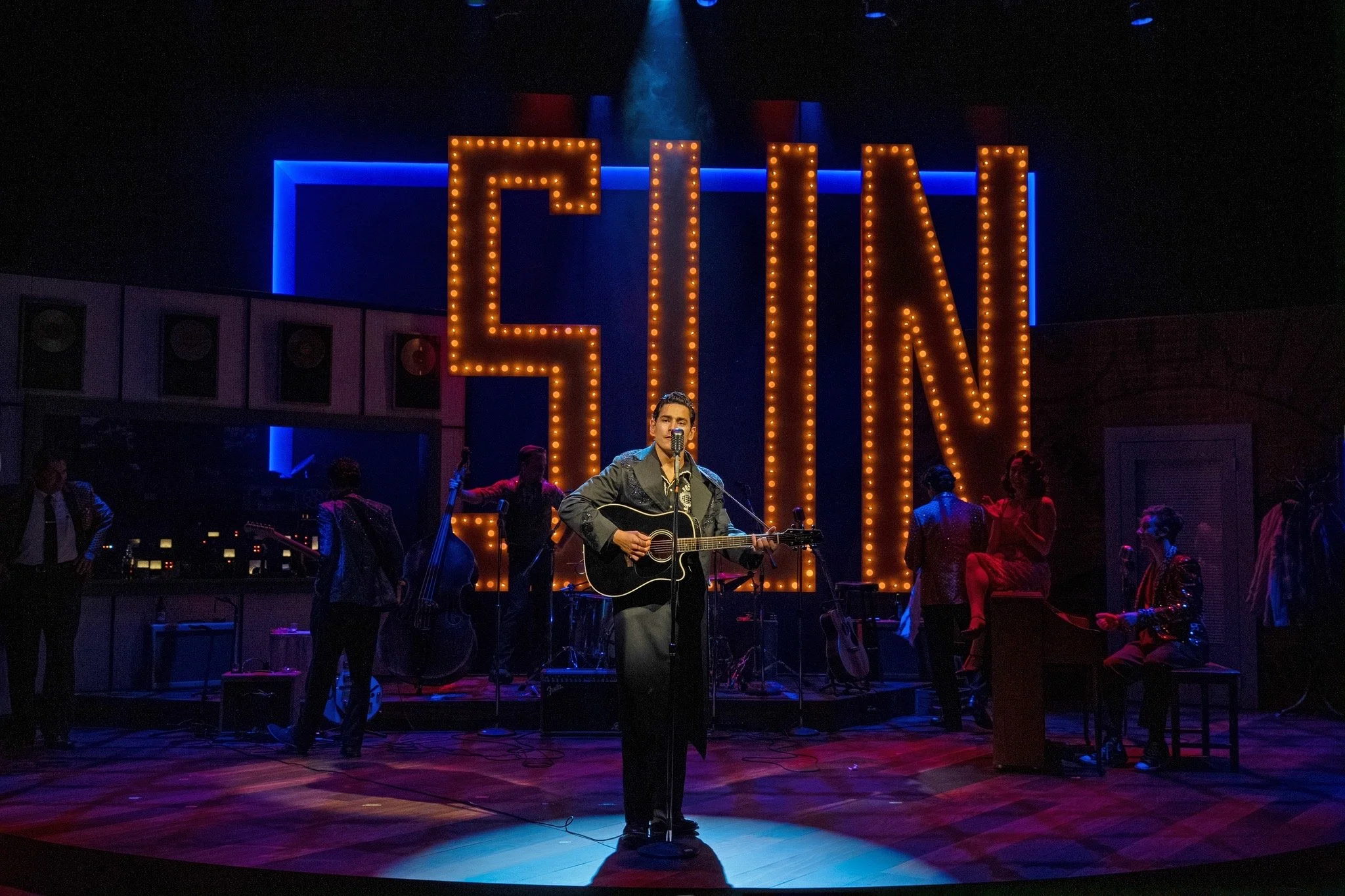 Million Dollar Quartet - Scenic design by Brandon PT Davis. A vibrant 1950s recording studio set, capturing the iconic session with musical instruments and warm, focused lighting.