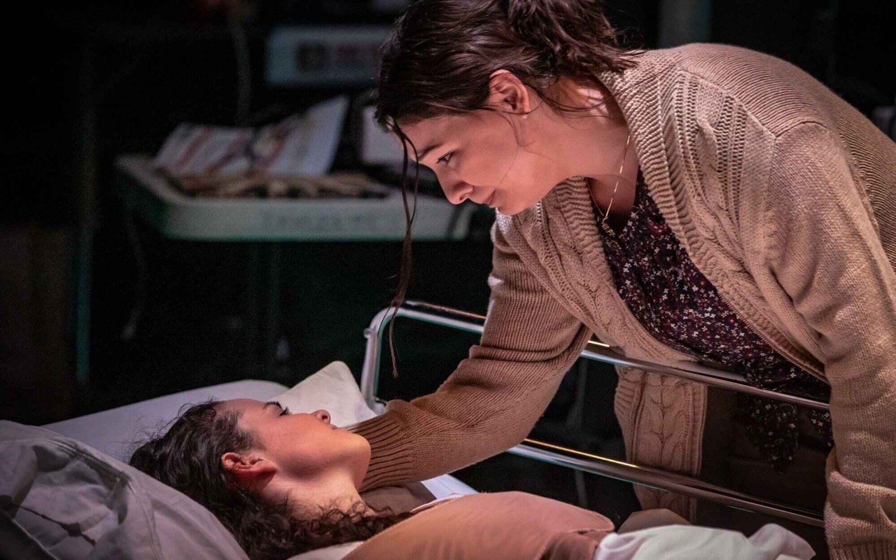 Parliament Square - Scenic design by Brandon PT Davis. A stark, modern set with geometric shapes and cool lighting, evoking a sense of urban tension.