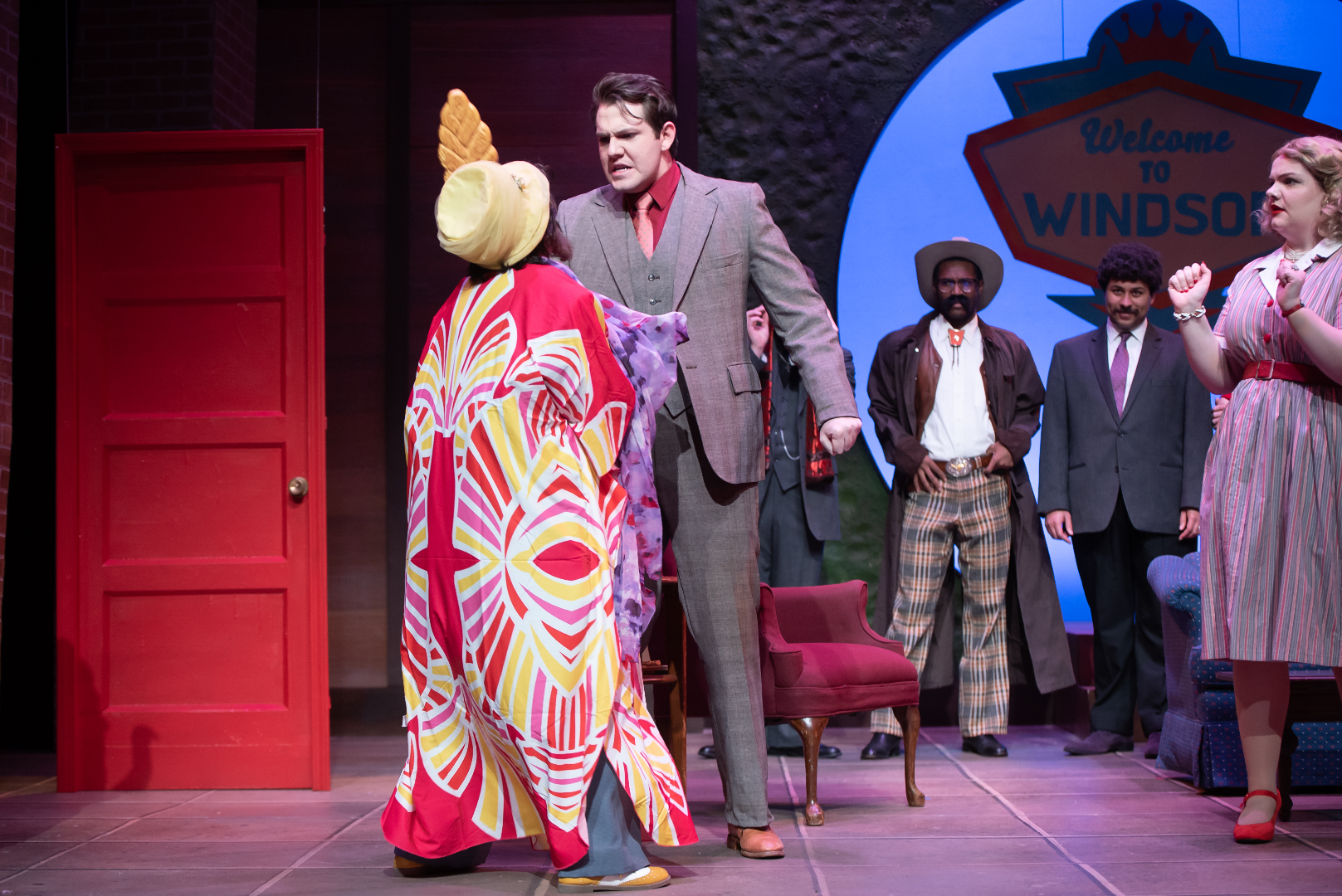 The Merry Wives of Windsor - Scenic design by Brandon PT Davis. Traditional Elizabethan setting, rustic charm, vibrant colors, and warm lighting evoke a comedic atmosphere.