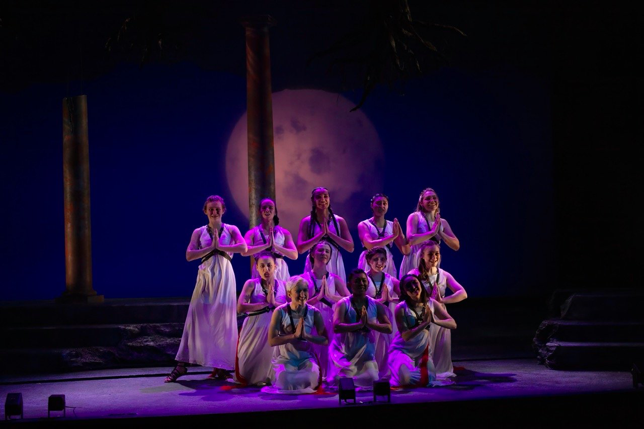 The Penelopiad - Scenic design by Brandon PT Davis. A minimalist set evoking ancient Greece, with flowing fabrics and subtle lighting to highlight Penelope's narrative.