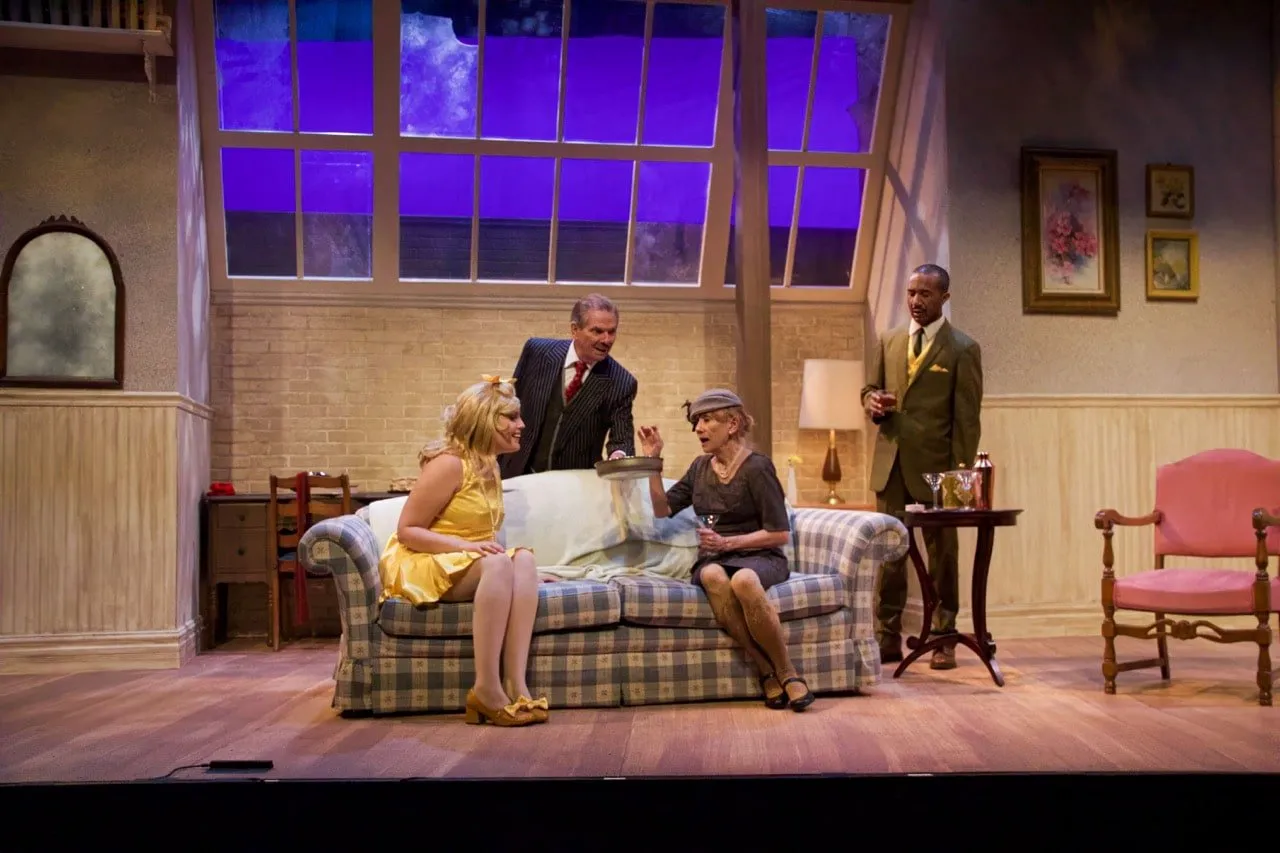 Barefoot in the Park - Scenic design by Brandon PT Davis. A cozy, slightly cluttered New York City apartment set with warm lighting, reflecting the playful spirit of newlyweds.